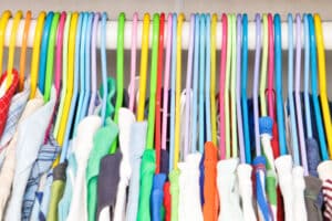 Selection,Of,Colorful,Clothes,Hanging,In,A,Wardrobe