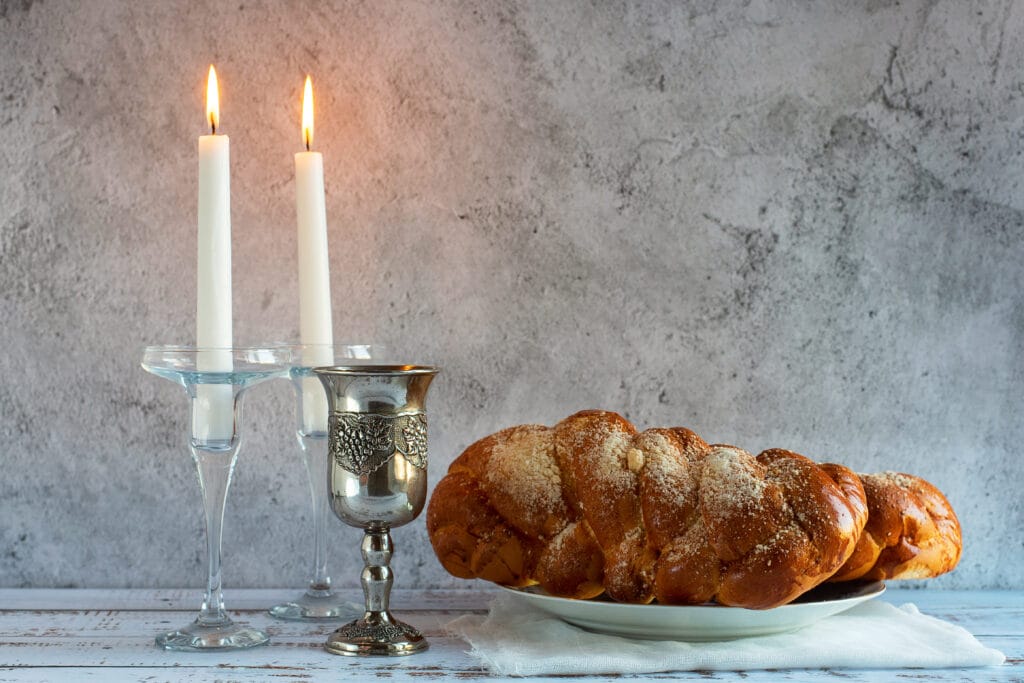 shabbat shalom challah bread shabbat wine candles wooden table