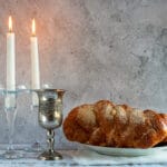 shabbat shalom challah bread shabbat wine candles wooden table